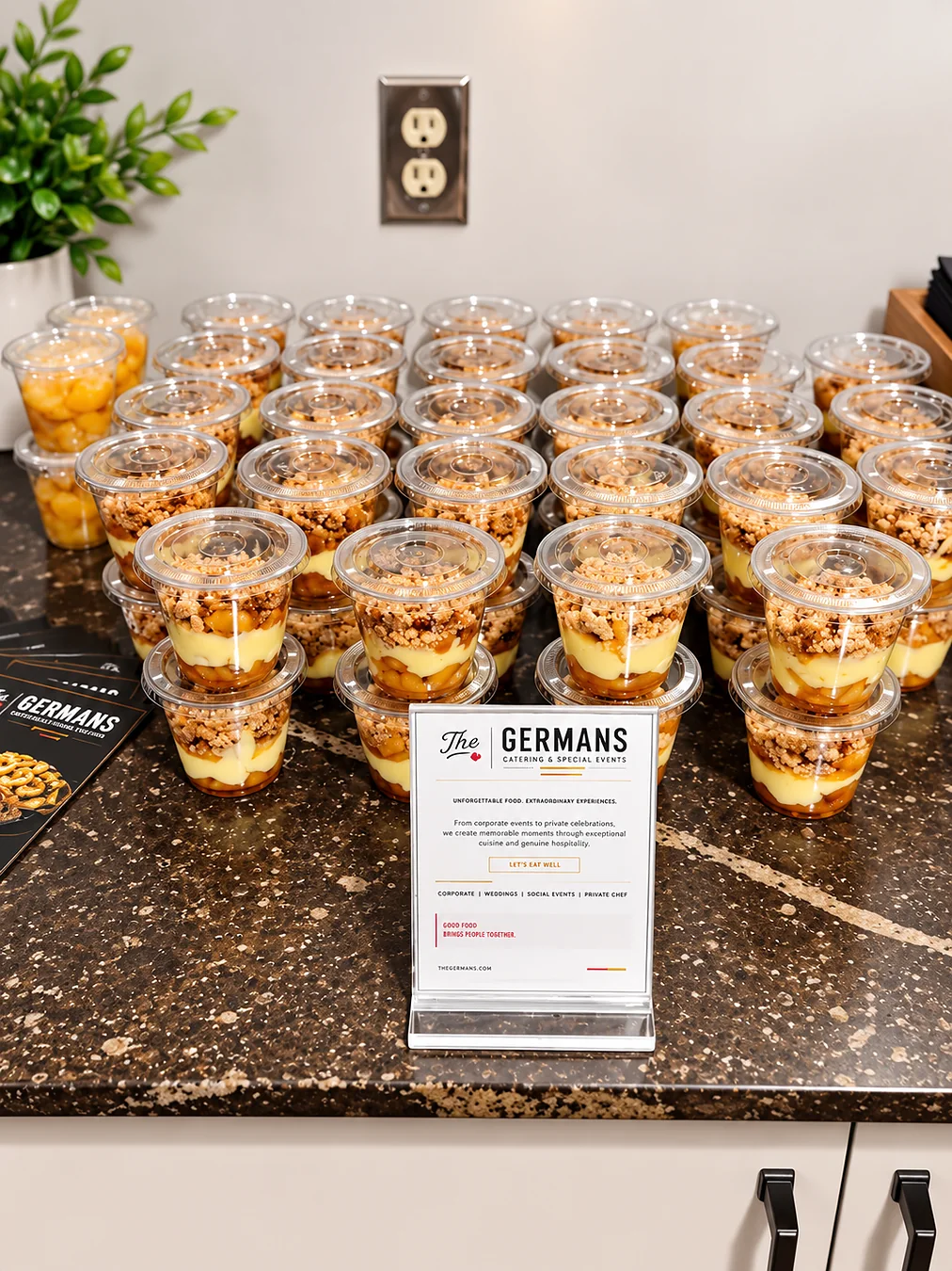 Individual dessert cups prepared for a catering event